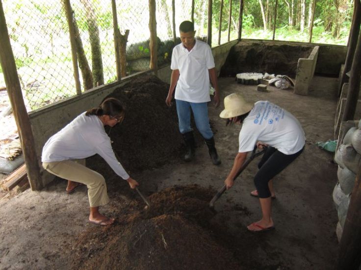 Mixing up the soil mix of cooked soil, vermicompost, and carbonized rice hull. Kuya Robert is boss.