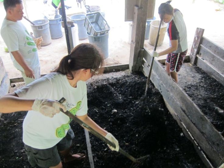 Mixing the new batch of compost