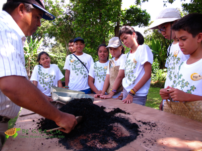Kuya Henry mixing the compost that we produce onsite